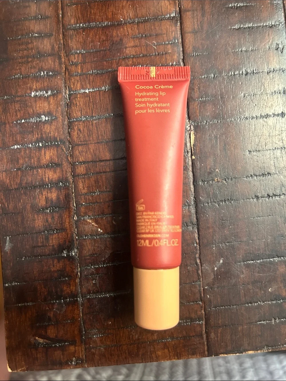 Ole Henriksen Pout Preserve Peptide Lip Treatment - Red tube with Peach Cap